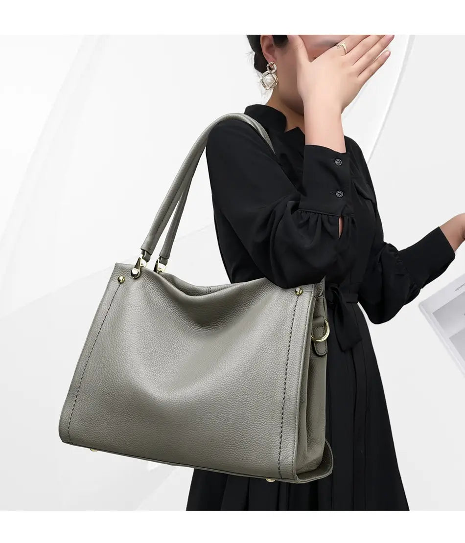 Simple Cowhide Leather Bag with Multiple Compartments and Adjustable Shoulder Strap