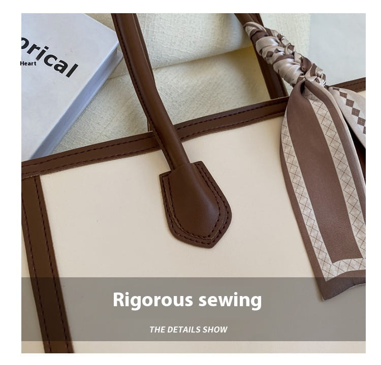 Czarna i brązowa skórzana torba na ramię z zewnętrznym kieszeni na zamek błyskawiczny