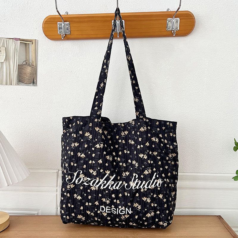 Black Apricot Miraflor Crossbody Bag with White and Red Letters for the United States - Teleplus united states chf