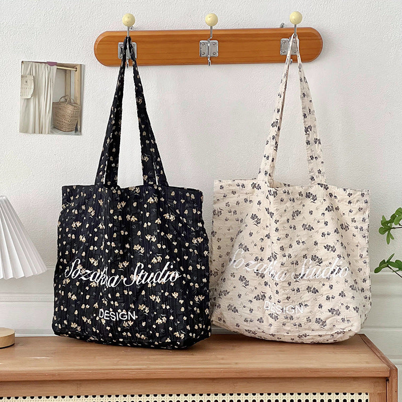 Black Apricot Miraflor Crossbody Bag with White and Red Letters for the United States - Teleplus united states chf