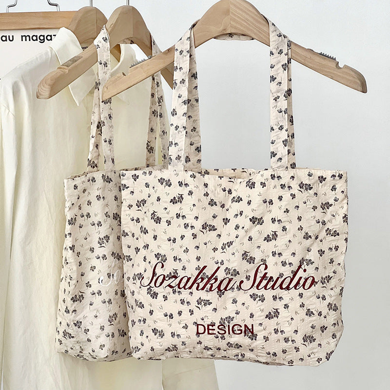 Black Apricot Miraflor Crossbody Bag with White and Red Letters for the United States - Teleplus united states chf