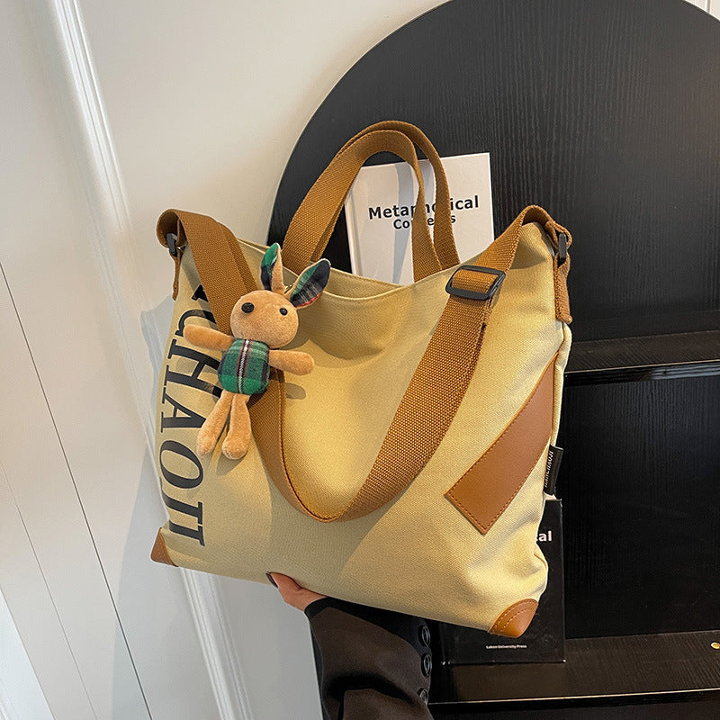 Canvas Shoulder Messenger Bag with Pendant in Multiple Colors - Teleplus canvas shoulder messenger bag