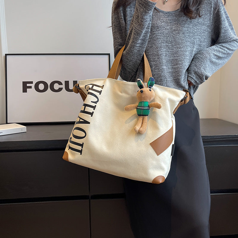 Canvas Shoulder Messenger Bag with Pendant in Multiple Colors - Teleplus canvas shoulder messenger bag