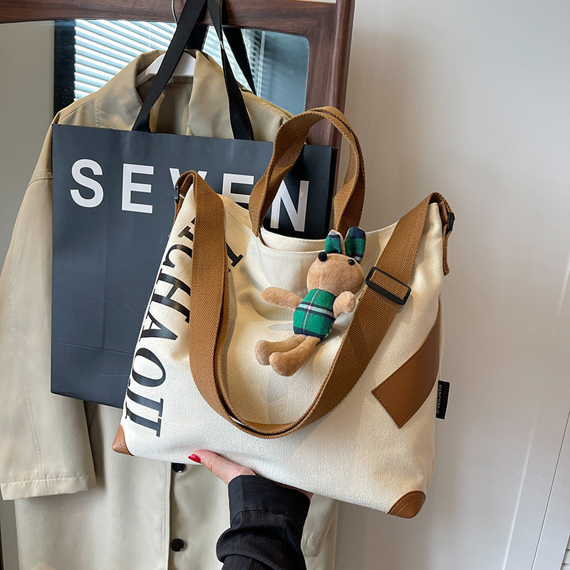 Canvas Shoulder Messenger Bag with Pendant in Multiple Colors - Teleplus canvas shoulder messenger bag