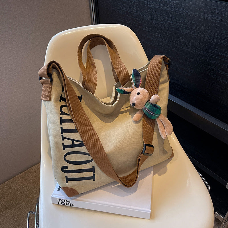 Canvas Shoulder Messenger Bag with Pendant in Multiple Colors - Teleplus canvas shoulder messenger bag