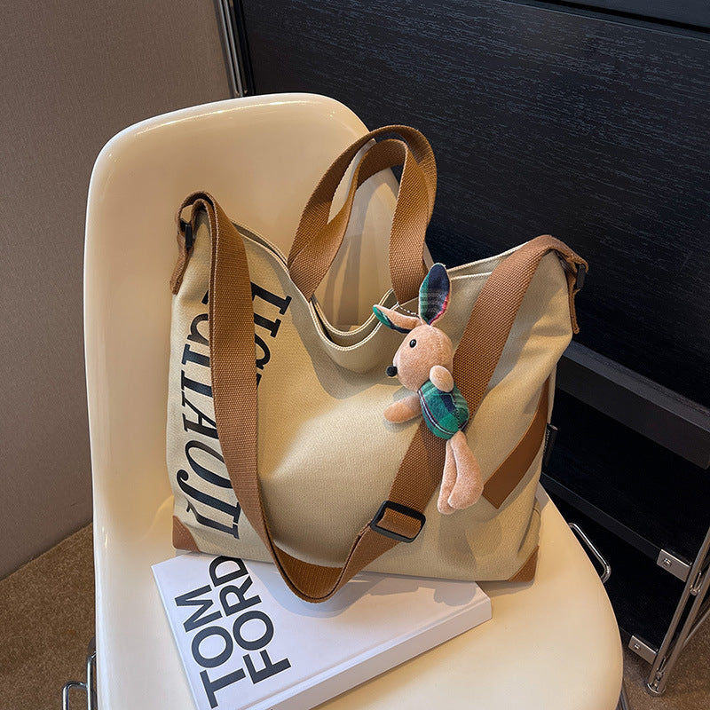 Canvas Shoulder Messenger Bag with Pendant in Multiple Colors - Teleplus canvas shoulder messenger bag