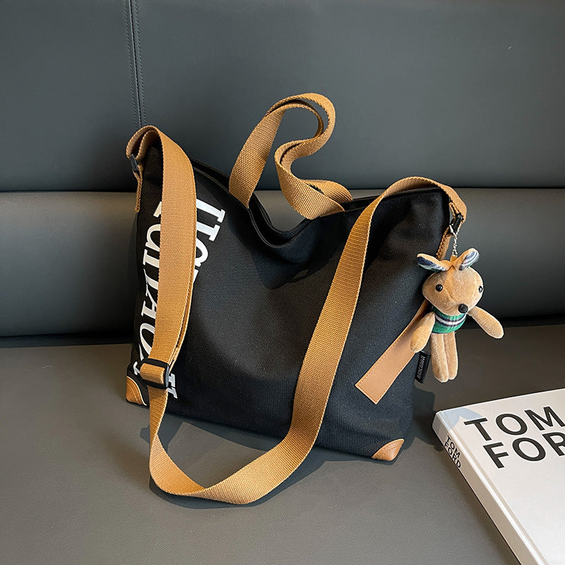 Canvas Shoulder Messenger Bag with Pendant in Multiple Colors - Teleplus canvas shoulder messenger bag