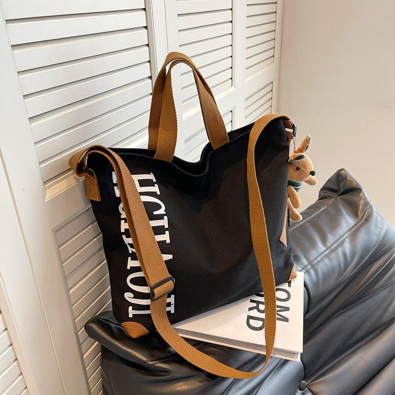 Canvas Shoulder Messenger Bag with Pendant in Multiple Colors - Teleplus canvas shoulder messenger bag