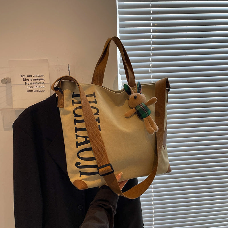 Canvas Shoulder Messenger Bag with Pendant in Multiple Colors - Teleplus canvas shoulder messenger bag