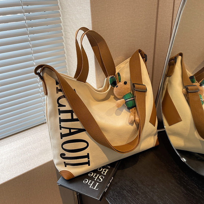 Canvas Shoulder Messenger Bag with Pendant in Multiple Colors - Teleplus canvas shoulder messenger bag