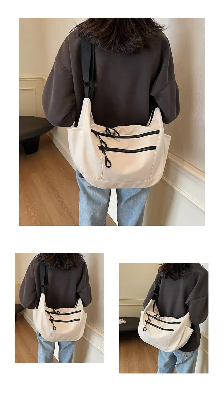 Lerret dumpling pose medium crossbody veske med glidelåslomme for kvinner