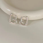 Silver Love Knot Ear Clips for Women in the United States CHF Chf Compatible - Tying Knots with Heart Earrings united