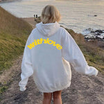 White oversized cotton blend men’s hoodie with pocket displaying withlove text for teenagers